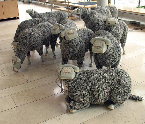 art installation consisting of 32 sheeps/phones by Jean Luc Cornec
