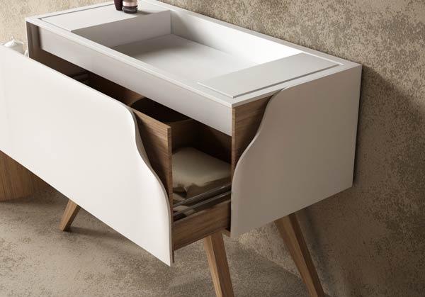 Wash basin with open cabinet.