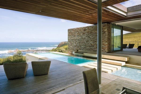 A covered terrace is overlooking the sea. Architectural design by Stefan Antoni Olmesdahl Truen Architects (SAOTA).