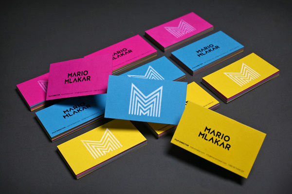 Colored business cards with the repetitive letter M for filmmaker Mario Mlakar.