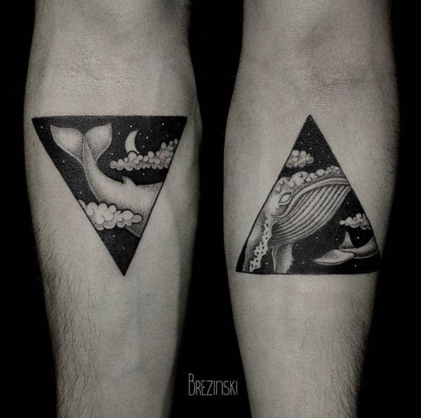 Double motive tattoos for the right and left arm in the form of triangles.
