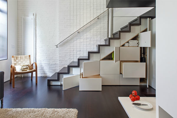 Compartments below the staircase provide enough storage space despite the little space.