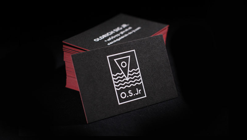 Beautiful black and white business card design with striking red edges.