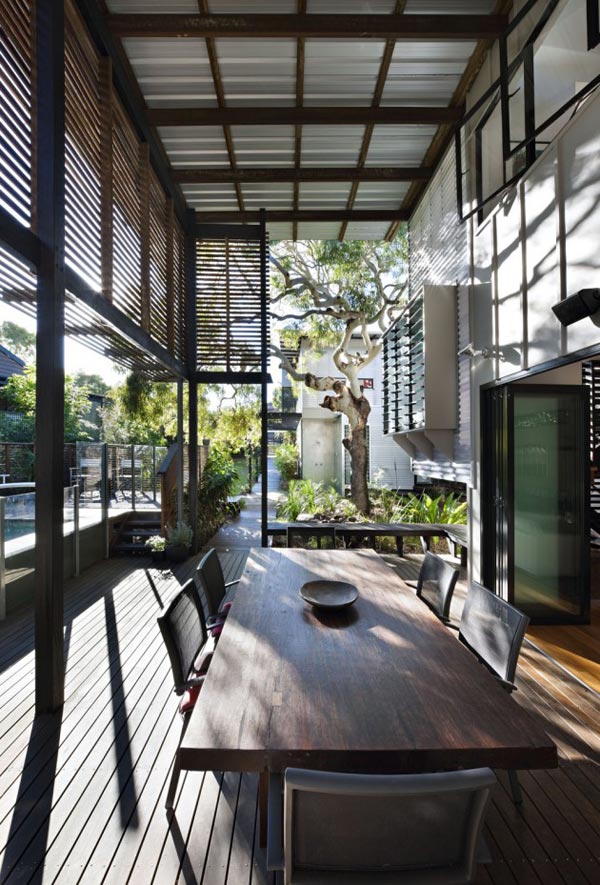 The covered double height outdoor space of the house.