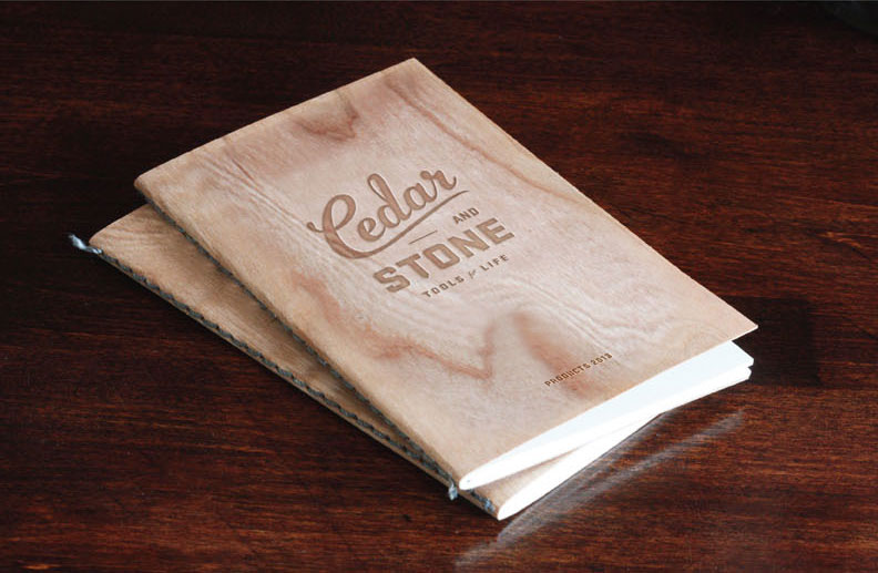 Brochure cover with logo and a wooden look.