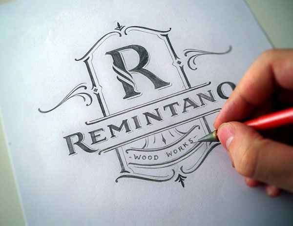 Remintano Wood Works - Logo design process created by hand. The work is based on a custom made design and typography.