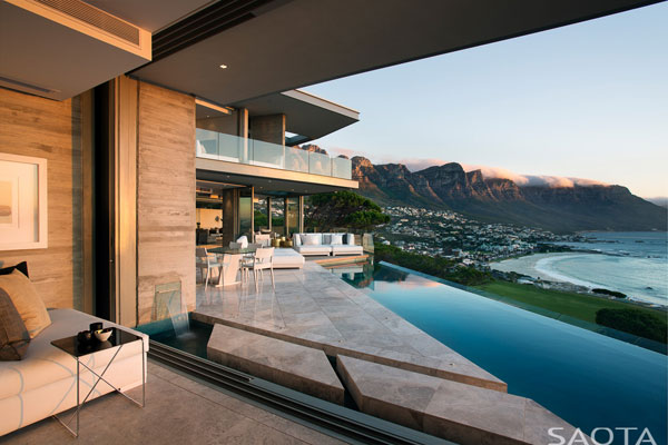 The dream house in Cape Town, South Africa provides breathtaking views of the coast and and the mountains to the side.