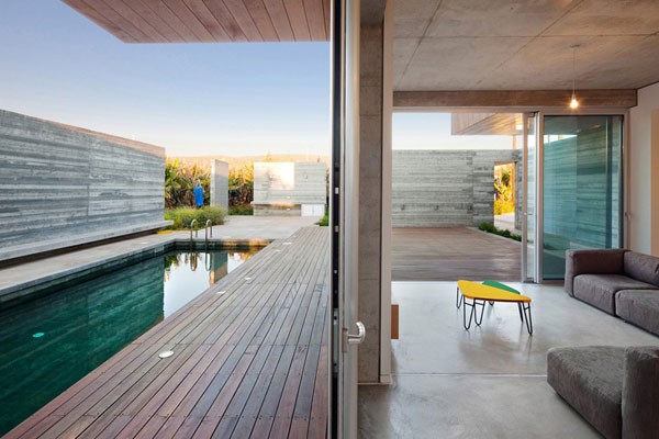 Pool area of the house - The home is characterized by a nice mix of wood and concrete.