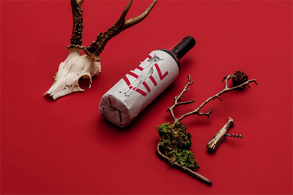 Wine bottle design with unique restaurant imaging.