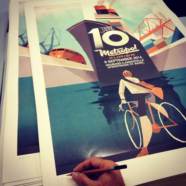 Illustrator Riccardo Guasco is signing some posters.