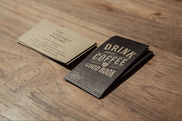 The vintage inspired business cards of the Assembly Store brand identity.