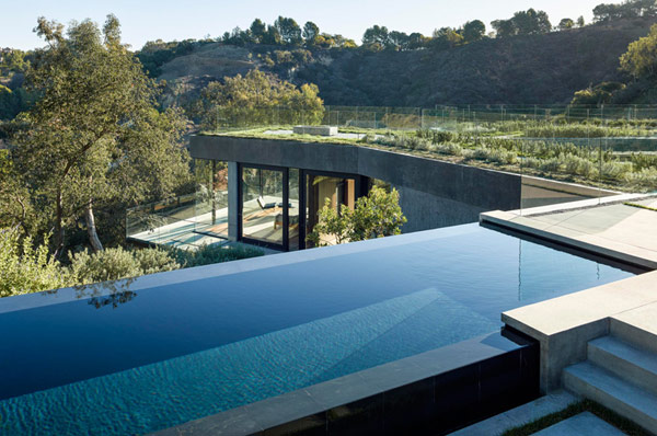The luxurious house of glass and concrete provides great views.