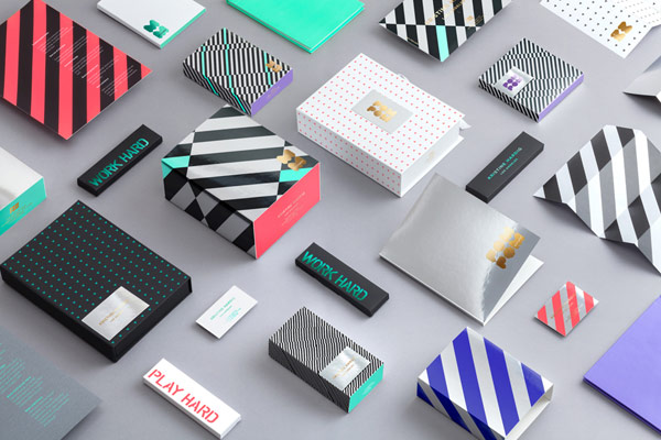 A colorful set of diverse branding materials, stationery, and packaging.