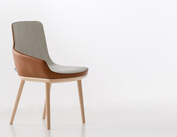 This asymmetrical armchair catches your attention from every angle.