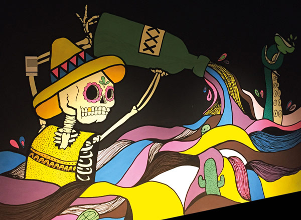 Street artwork with skeleton.