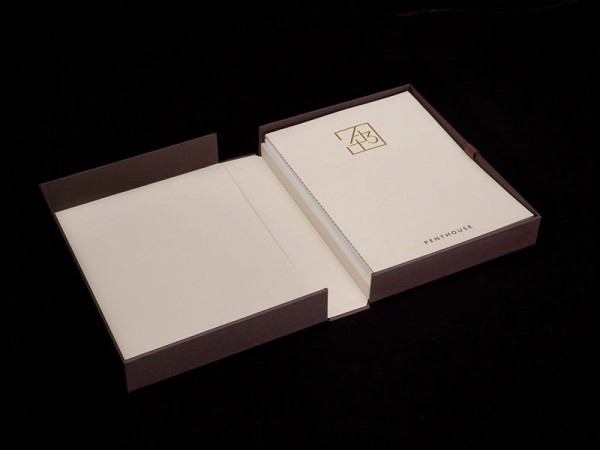 Open box with printed collateral.