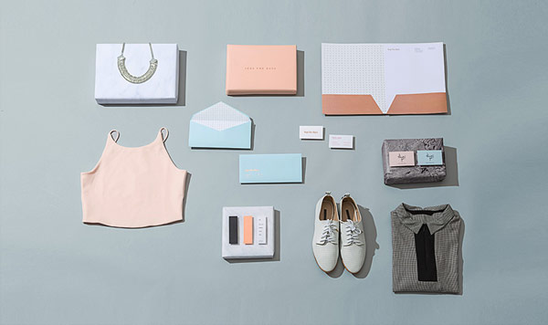 Some clothes and branding materials including stationery and packaging.