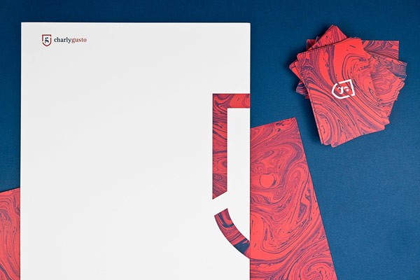 Corporate identity and marbled stationery with a British touch created by Mubien Studio for Charly Gusto.