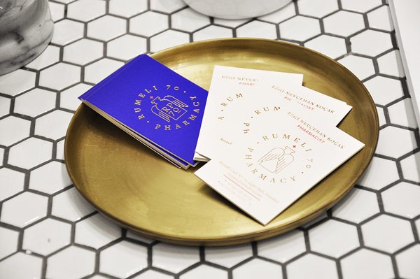 All texts have been printed in a golden color on the business cards.