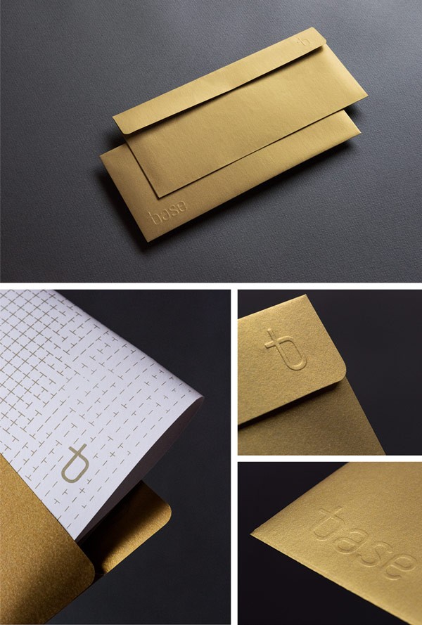 Golden envelopes with embossed logotype.