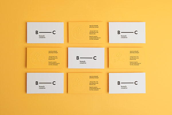 Two-sided business cards in black and yellow colors.
