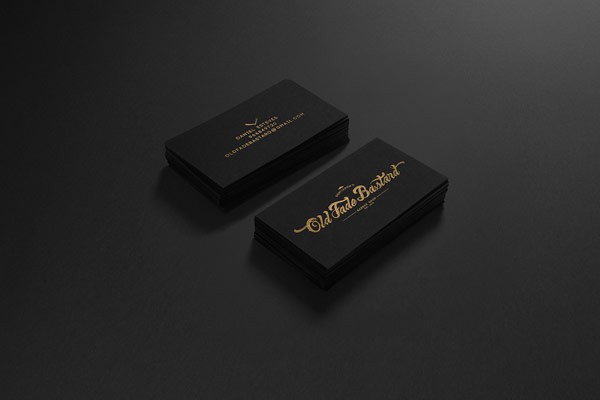 Black business cards with golden logotype.