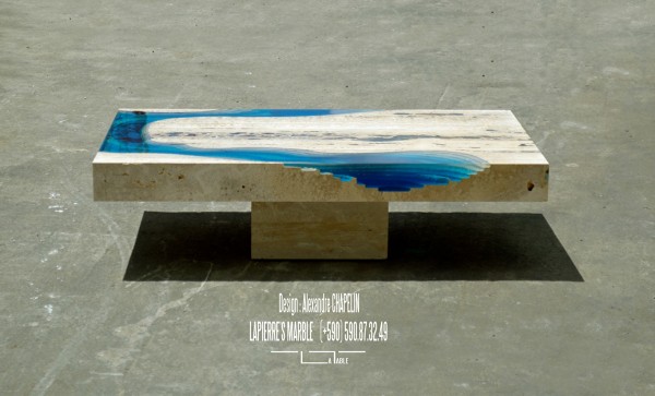 The table has been sculpted from a piece of marble.