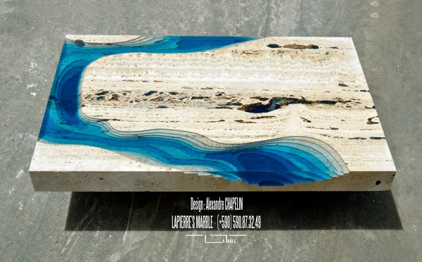 The coffee table has a sculpted drop to show the slopes of the ocean or the lagoon.