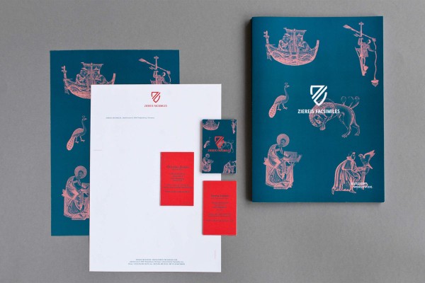The printed collateral including stationery, business cards, and the company brochure.