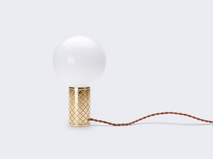 The minimalist design is inspired by a bicycle grip that holds a light bulb.