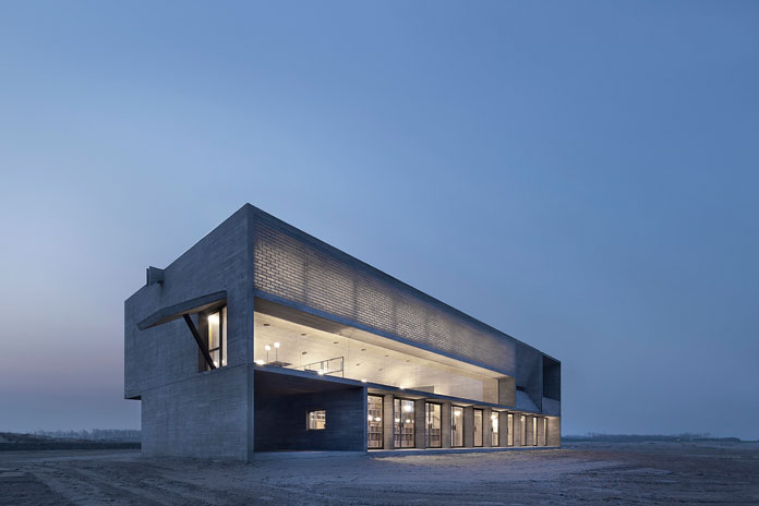 The Seashore Library – modern and minimalist concrete-clad monolithic architecture designed by Vector Architects.