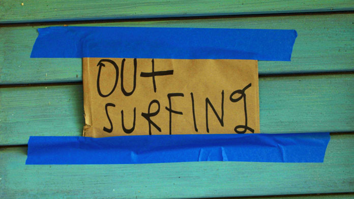 "Out Surfing", that note at his door says it all.
