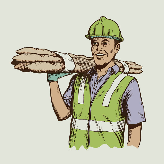 A construction worker is carrying delicious baguettes.