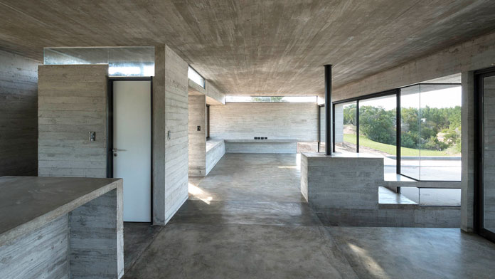 VP House by Luciano Kruk, Rough concrete interior.