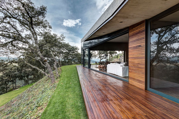 Covered wood exterior space, GG House by Elías Rizo Arquitectos.