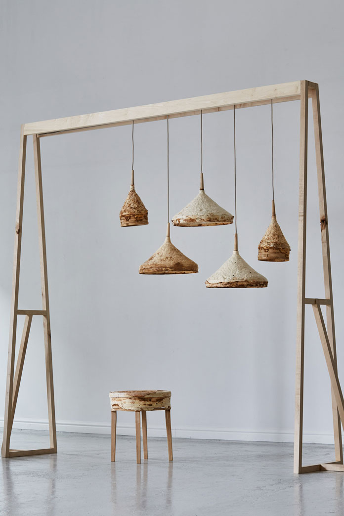 A stool and a series of hanging lamps.