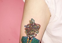 Colorful illustrative tattoo.