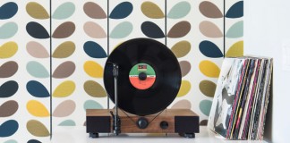 This high-performance vertical turntable with full-range stereo speakers is also a stylish design element for your home.