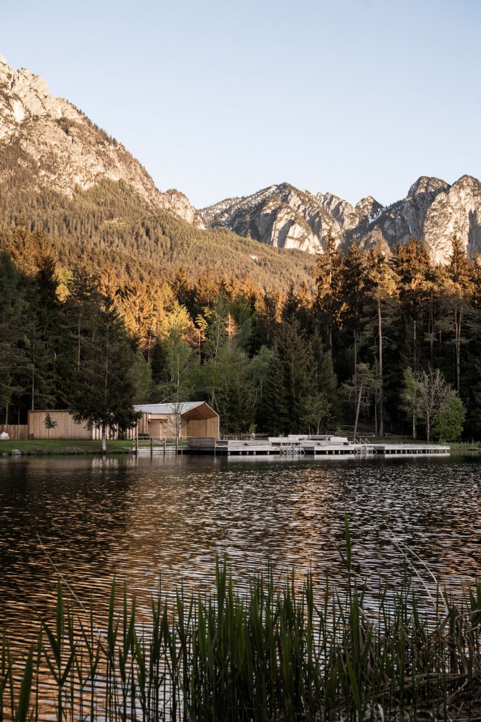 Lake House Völs, a discreet and small lake-hut in the heart of the magnificent mountain landscape of the Sciliar in the South Tyrolean Dolomites in Italy.