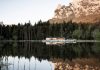Lake House Völs, a discreet and small lake-hut in the heart of the magnificent mountain landscape of the Sciliar in the South Tyrolean Dolomites in Italy.