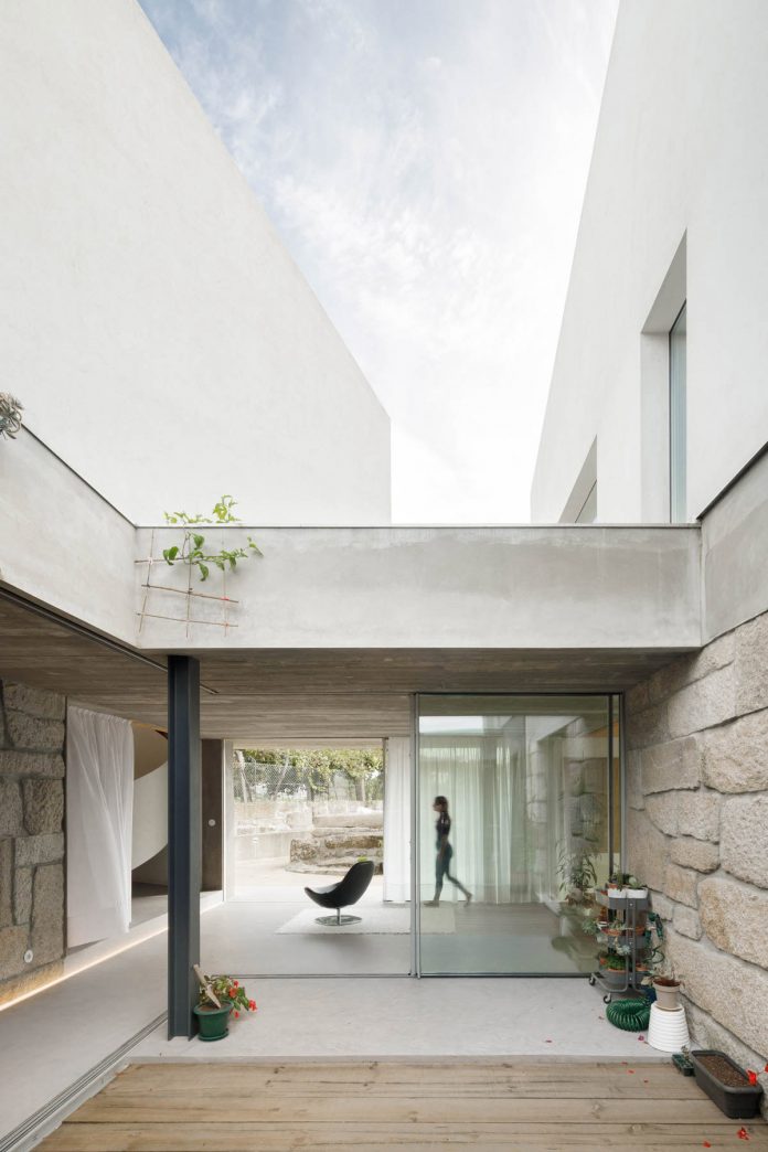 Three old houses converted into one by Paulo Merlini Architects.