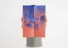 Photoshop Poster Mockup by Moixó Studio of a Man Holding an Unfolded Graphic Poster Design