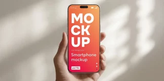 This Customizable iPhone Mockup PSD File Is the Smartphone Template Designers Actually Need A smartphone Photoshop mockup of a hand holding an iPhone in a daylight setting.
