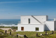Tiago Sousa’s New House in Caminha Is 123 Square Meters of Rock, Concrete, and One Long Staircase Casa Âncora, a project by Tiago Sousa in Caminha, Portugal, photographed by Ivo Tavares.